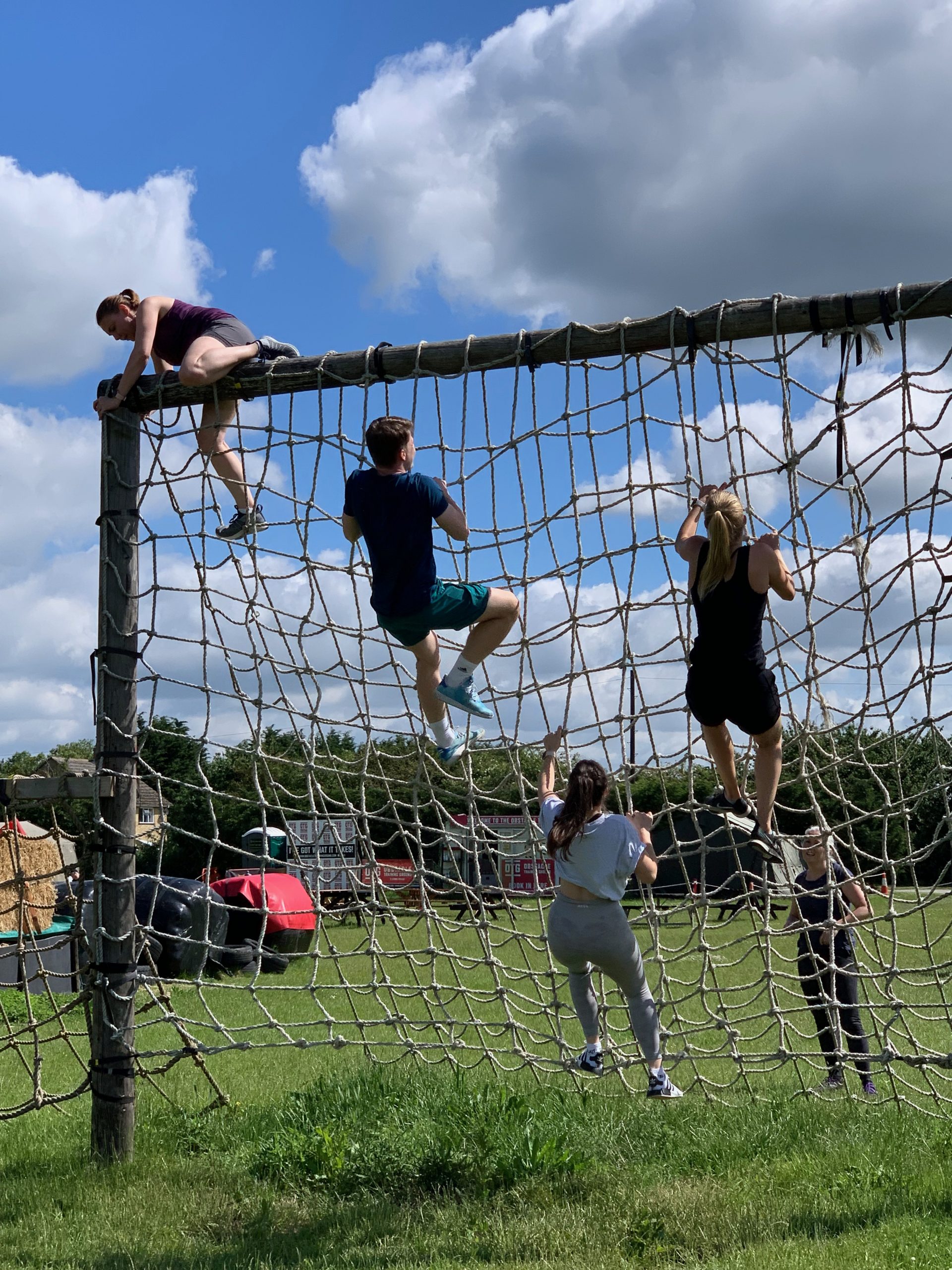 Coaches and parents tackling the cargo net
