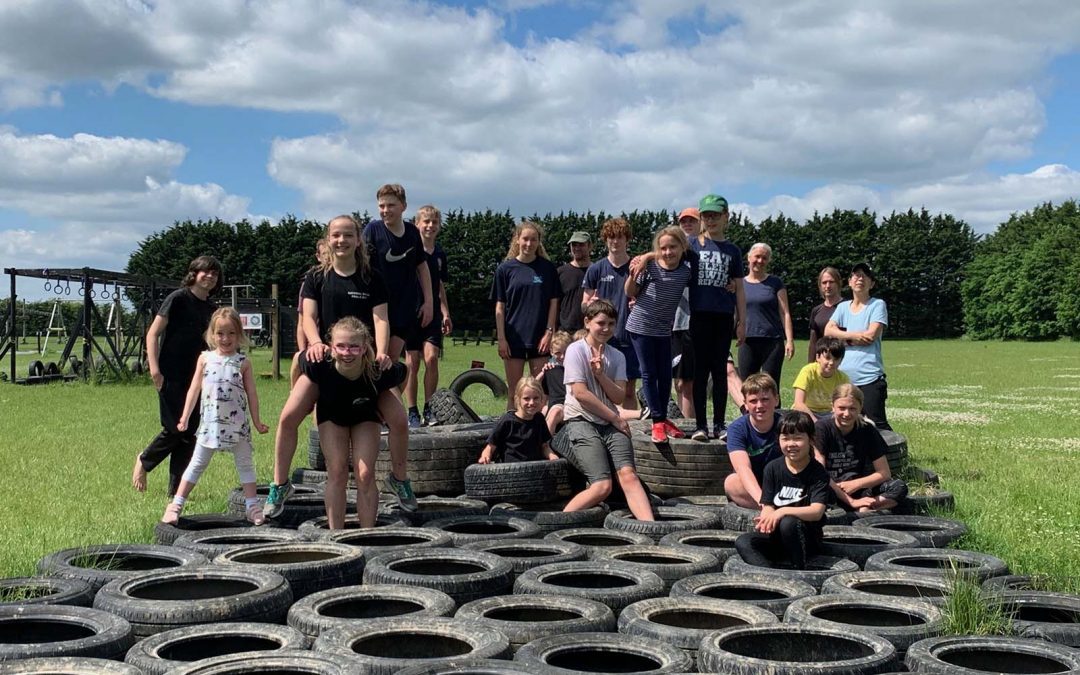 Divers tackling an obstacle course on a fun day out
