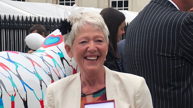 Smiling and smartly dressed Club President Sharyn Bord receiving the Harold Fern Award.